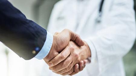 Pharmacy partners shaking hands